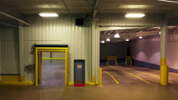 Cinematic dolly shot in empty loading dock for heavyweight cargo trucks garage — Stock Video