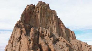 Aerial shot epic mountain ridge. Aerial view of Shiprock Cliffs in New Mexico 4K