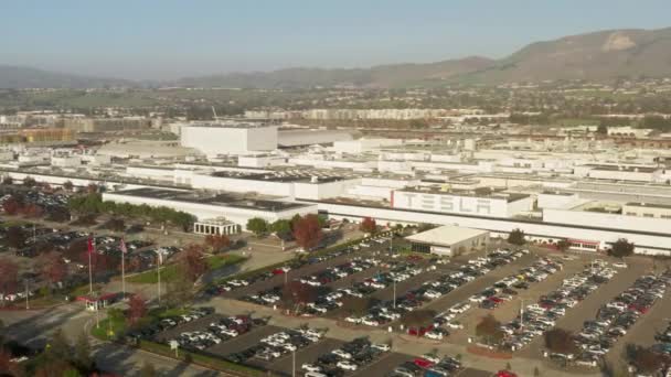 Tesla electric self driving cars big parking lot, high quality 4K drone aerial — Αρχείο Βίντεο