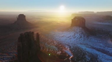 Epic winter landscape in world famous Monument Valley Utah USA, aerial scene 4K