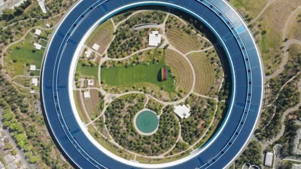 Aerial view of a massive circular building with innovative design — Stock Video