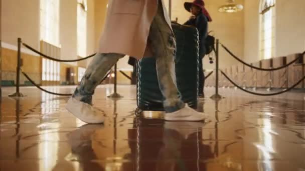 Business people at airport terminal or railroad station pulling trolley bag 6K — Stock Video