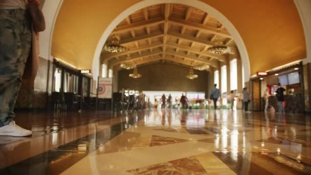 Female with bag on heels walking in hallway with arched ceiling, city travel RED — Stock Video