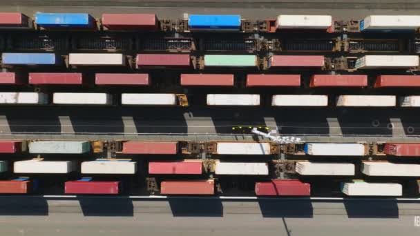 Abstract overhead drone shot shows colorful containers — Stockvideo