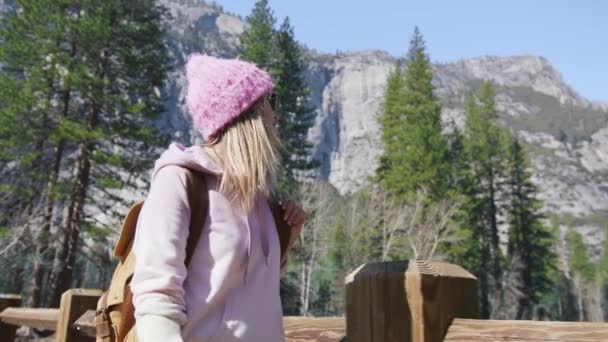 Smiling woman hiker on sunny spring day in mountain valley, Hiking traveler 6K — Video Stock