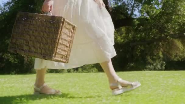 Closeup unrecognizable Beautiful Boho Woman Legs in sandals walks through park — Video