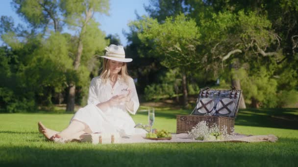 Positive romantic woman talking smartphone in summer park outdoors, RED shot 6K — Vídeo de Stock