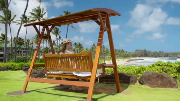 Back View Elegant Lady Swinging Wooden Swing Luxury Resort Scenic — Stock Video