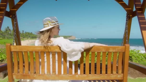 Slow Motion Woman White Hat Frangipani Flowers Swinging Cinematic Island — Stockvideo