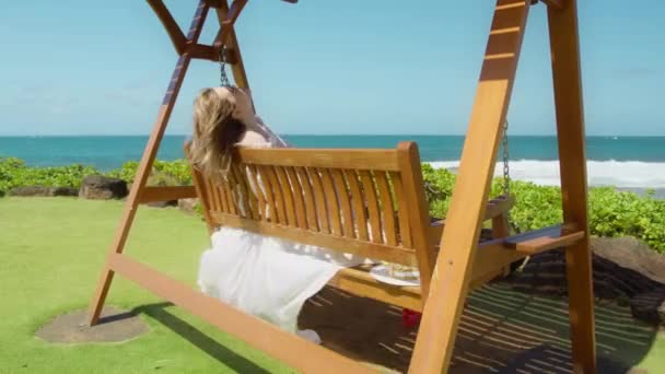 Carefree Woman Swinging Beautiful Blue Ocean View Raised Hands Wind — Stock video