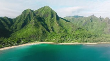Scenic green mountain coast nature background. Traveling pure nature of tropical island Kauai Hawaii USA. Cinematic aerial view wild nature the world famous coastline. Outdoors adventure and travel 4K