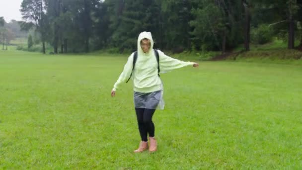 Happy Cute Smiling Young Woman Raised Hands Raincoat Enjoying Rain — Stockvideo
