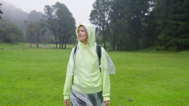 Cinematic Portrait Young Woman Looking Rain Nature Traveler Taking Raincoat — 图库视频影像
