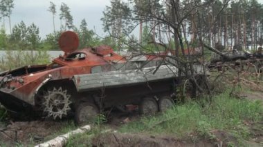 March, 2022. Irpin, Ukraine. Devastated close-up scene of a tank abandoned by Russian armed troops. Burnt military machinery at the outskirts of Kyiv capital city. High quality 4k footage