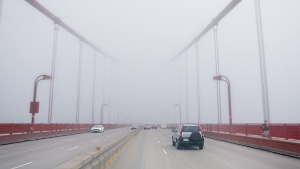 Self Driving Autonomous Car Speeding Suspension Bridge Covered Thick Fog — Vídeo de stock