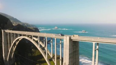 Aerial shot of Bixby Creek Bridge on the Big Sur coast park in west coast of California, USA. Little Big Lies show filming location and famous tourist attraction and landmark view point site, 4K drone