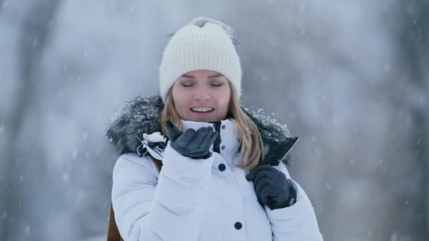 Carefree Attractive Young Woman Trying Catch Snowflake Palm Hand Grey — Video Stock
