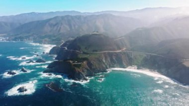Iconic landscape of Californian Central Coast as seen from above. Drone footage of majestic seascape with pristine mountains in the background. High quality 4k footage