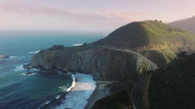 Amazing views of the bridges south end at sunset. Aerial view of one of the highest bridges in the world, above the bottom of a steep canyon. High quality 4k footage