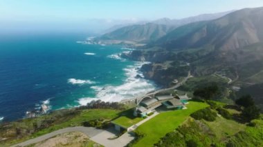 Beautiful Big Sur coast with road running from South to North California by cinematic landscape. Scenic route form Los Angeles to San Francisco popular among tourists. Luxury property ocean view house