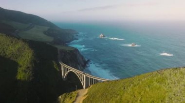 American National Scenic Byway along Big Sur coast within unique natural wilderness. Drone footage over scenic drive right up to the beach. High quality 4k footage