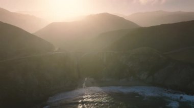 Drone footage of a must-see road trip spot along the Highway 1coastline. Amazing views of the bridges south end at sunset. High quality 4k footage