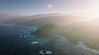 Drone footage of beautiful vistas of Big Sur along scenic drive along national park. Highway 1 through the coastline by the Pacific Ocean. High quality 4k footage