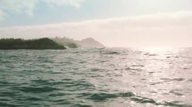 Aerial view of rugged and mountainous coastal area, washed by the Pacific Ocean. Dramatic scenery of scenic stretch of undeveloped coastline. High quality 4k footage