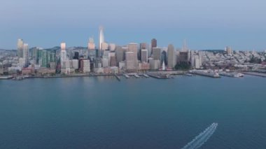 Aerial footage of central business district neighborhood of San Francisco. The cluster of high-rise towers surrounded by the natural harbor of the city. High quality 4k footage