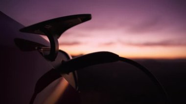 Cinematic shot under hatch of electric eco car charging port. Electric vehicle recharging battery, charging port plugging in EV modern car. Save ecology, alternative energy,sustainable future RED shot