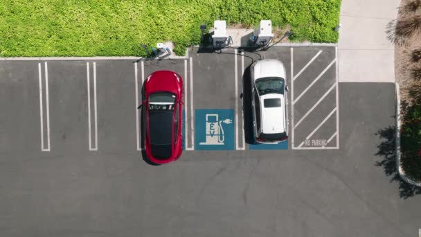 Aerial Overhead View Fully Charged Red Electric Vehicle Leaving Outdoor — Stockvideo