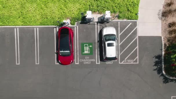 Aerial Overhead View Fully Charged Red Electric Vehicle Driving Away — Stockvideo