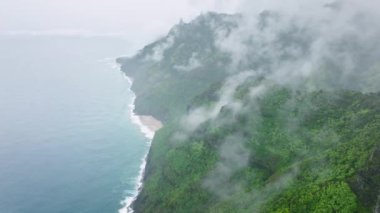 Drone footage of adventurous stretch of the extremely challenging trek along sheer mountains. Napali Coast Wilderness Park as seen from above. High quality 4k footage