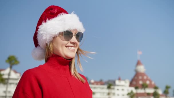 Smiling Woman 30S Red Sweater Santa Christmas Hat Having Fun — Stockvideo