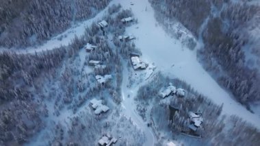 Winter Holidays in Snowmass village, closer to Aspen city in Colorado USA. Aerial view on Mountain chalets in ski resort at the snowy slopes. Christmas holidays, winter travel vacation, active people