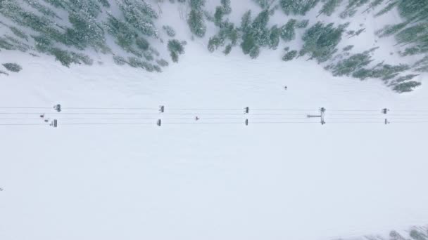 People Riding Ski Chairs Hill Scenic Mountain Forest Christmas Holiday — Stockvideo