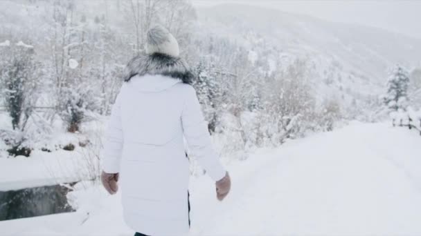 Camera Follows Woman Warm Fur Mittens Walking Winter River Young — Stock Video