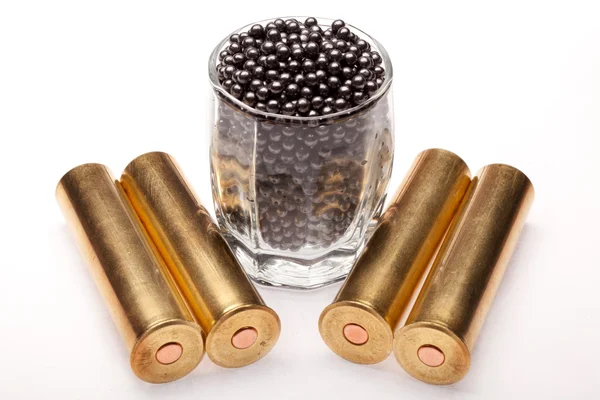 Shot and hunting cartridges on a white background — Stock Photo, Image
