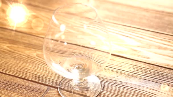 Pours a glass of cognac — Stock Video