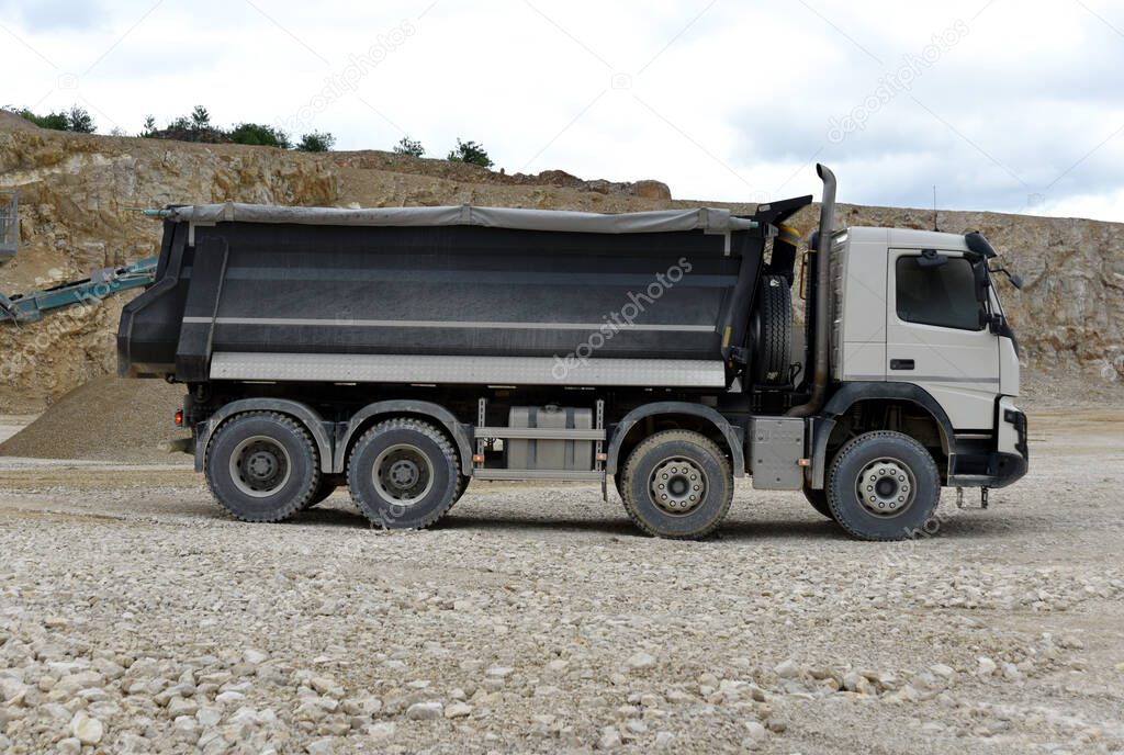 Big truck tipper drives in a quarry