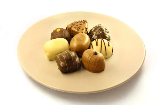 Chocolate bonbons on plate — Stock Photo, Image