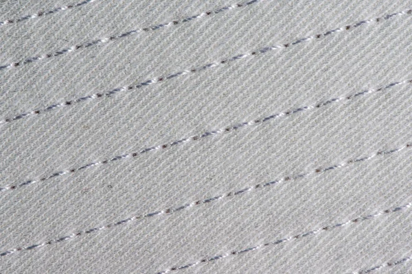 Białe bawełniane tkaniny z szwów tekstura tło. — Zdjęcie stockowe