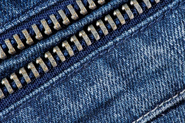 Kék farmert cipzár textúra háttérrel. — Stock Fotó