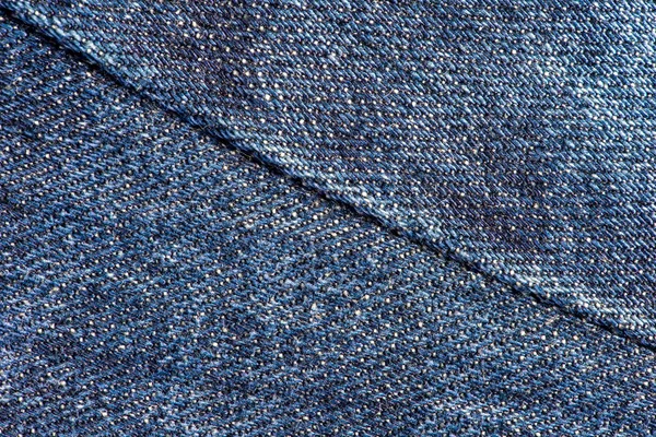 Blauwe denim jeans met naad textuur achtergrond. — Stockfoto