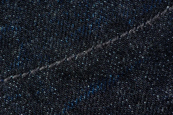 Ciemno niebieskie Spodnie jeansowe z szwów tekstura tło. — Zdjęcie stockowe