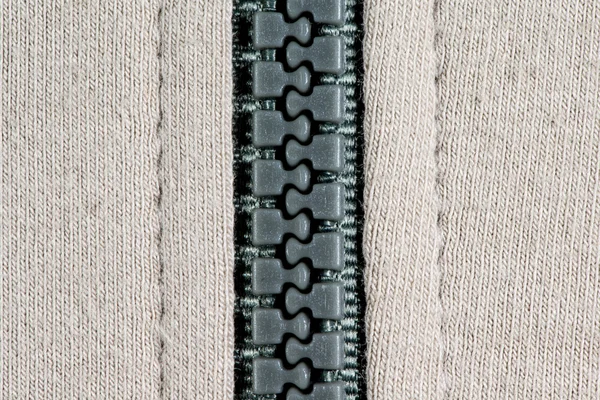 Lã de tricô branco com fundo de textura de zíper . Imagem De Stock