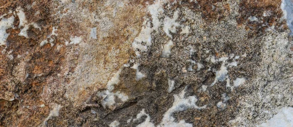 Piedra gris marrón natural como fondo o textura, sin costuras para el diseño —  Fotos de Stock