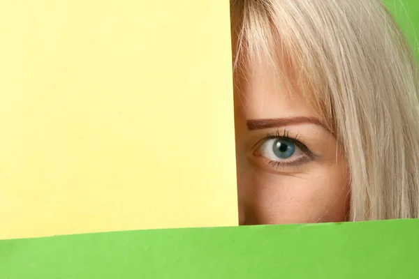 Girl watching out from a colorful surrounding — Stock Photo, Image