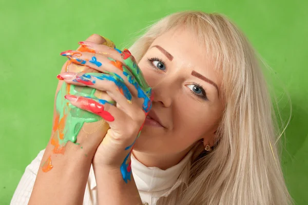 Portrait of an attractive woman with hands in fresh paint — Stock Photo, Image