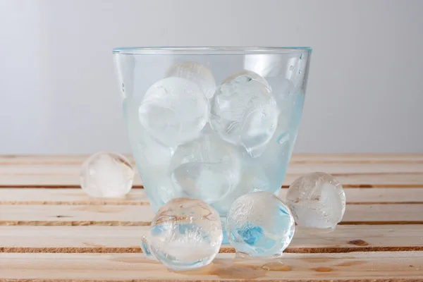 Glass full of ice balls